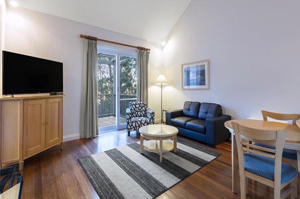 Oaks Cypress Lakes Resort 1 Bedroom Villa Living 2 600x400px.jpg